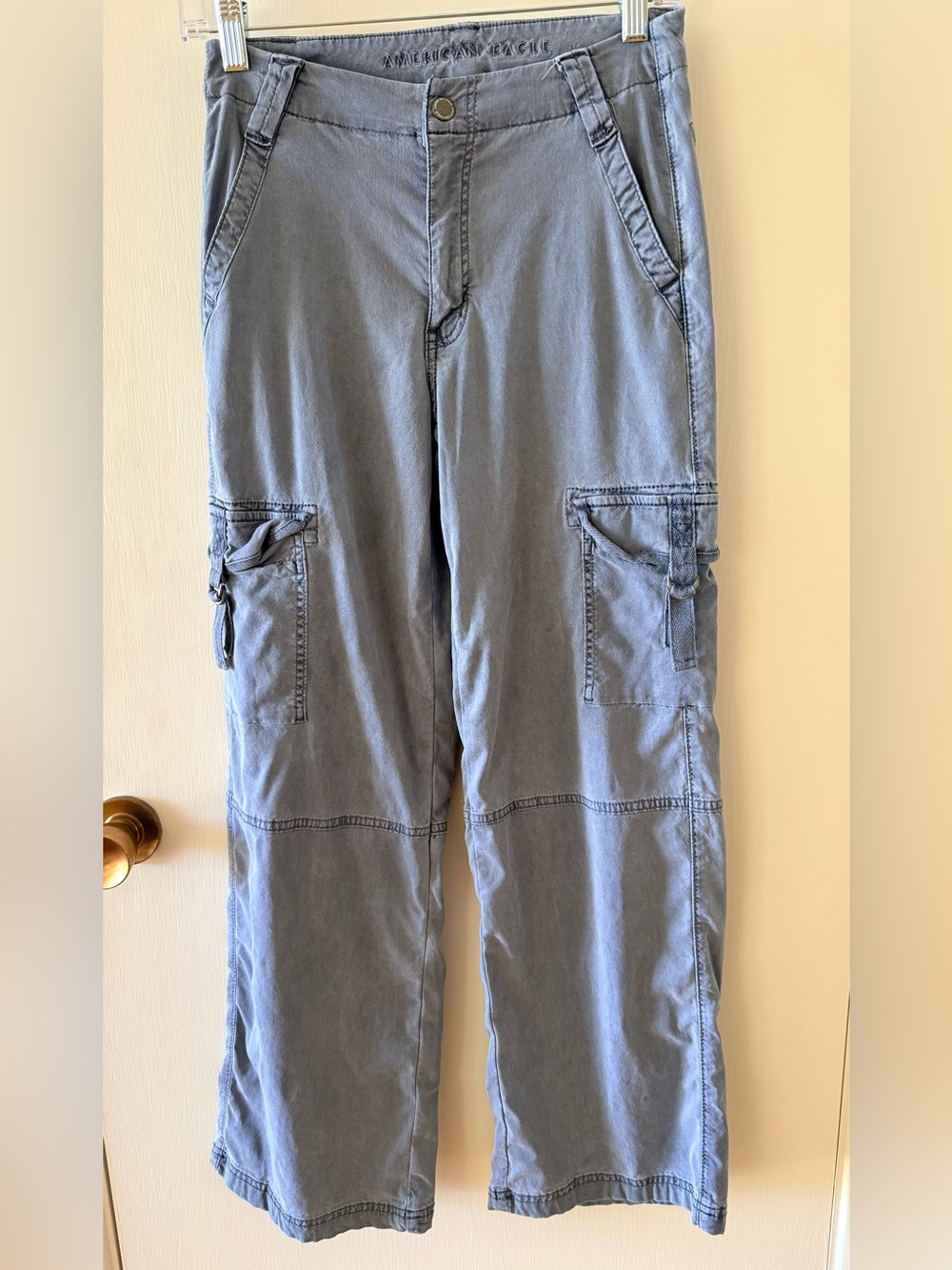 American Eagle cargo pants in a washed blue/gray color with a relaxed, wide-leg
